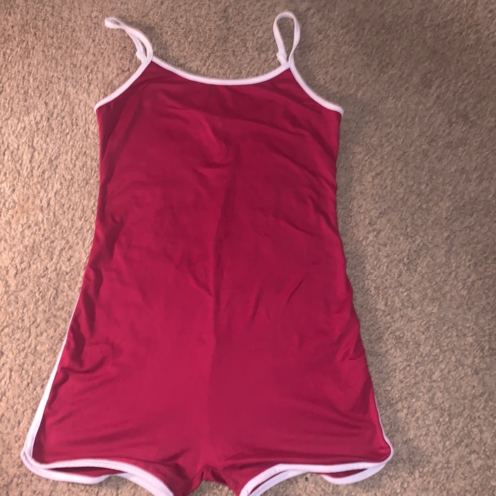 Maroon color one piece fashion nova.